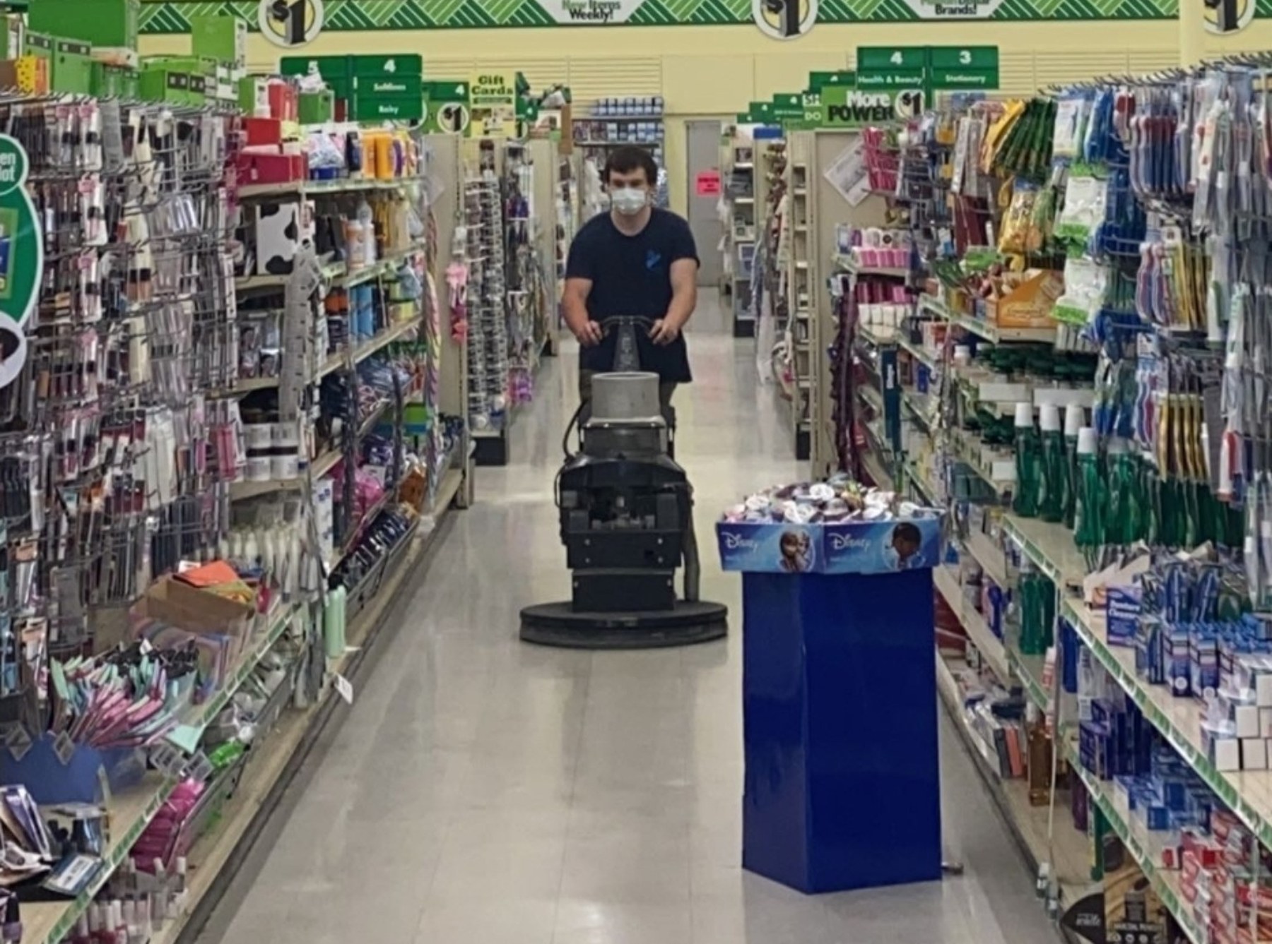 AUS operator running propane buffer in retail aisle