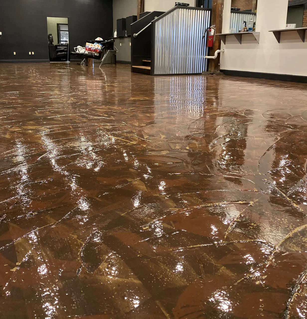 Completed brown specialty hard-floor finish in a customer-facing commercial space in Ashland, Kentucky