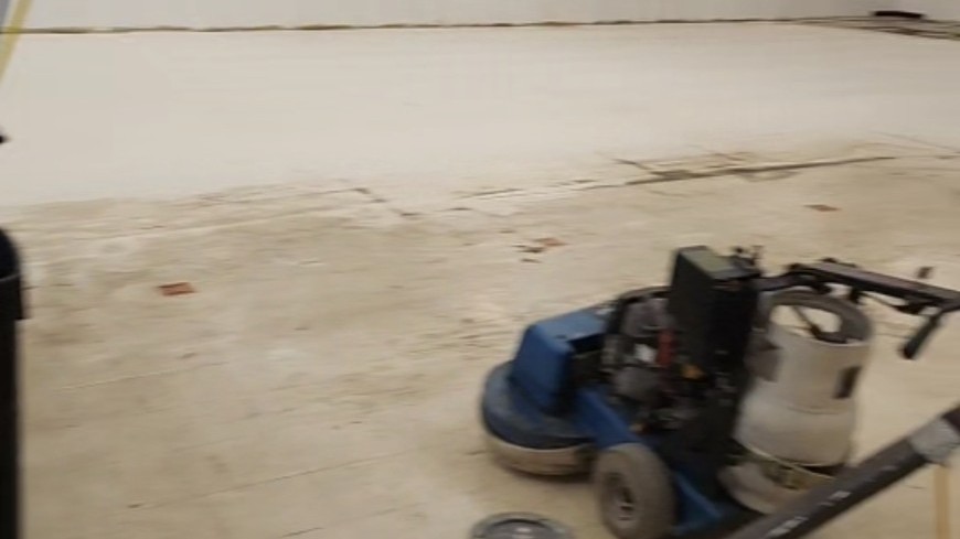 Mechanical finish removal in progress with propane burnishing equipment